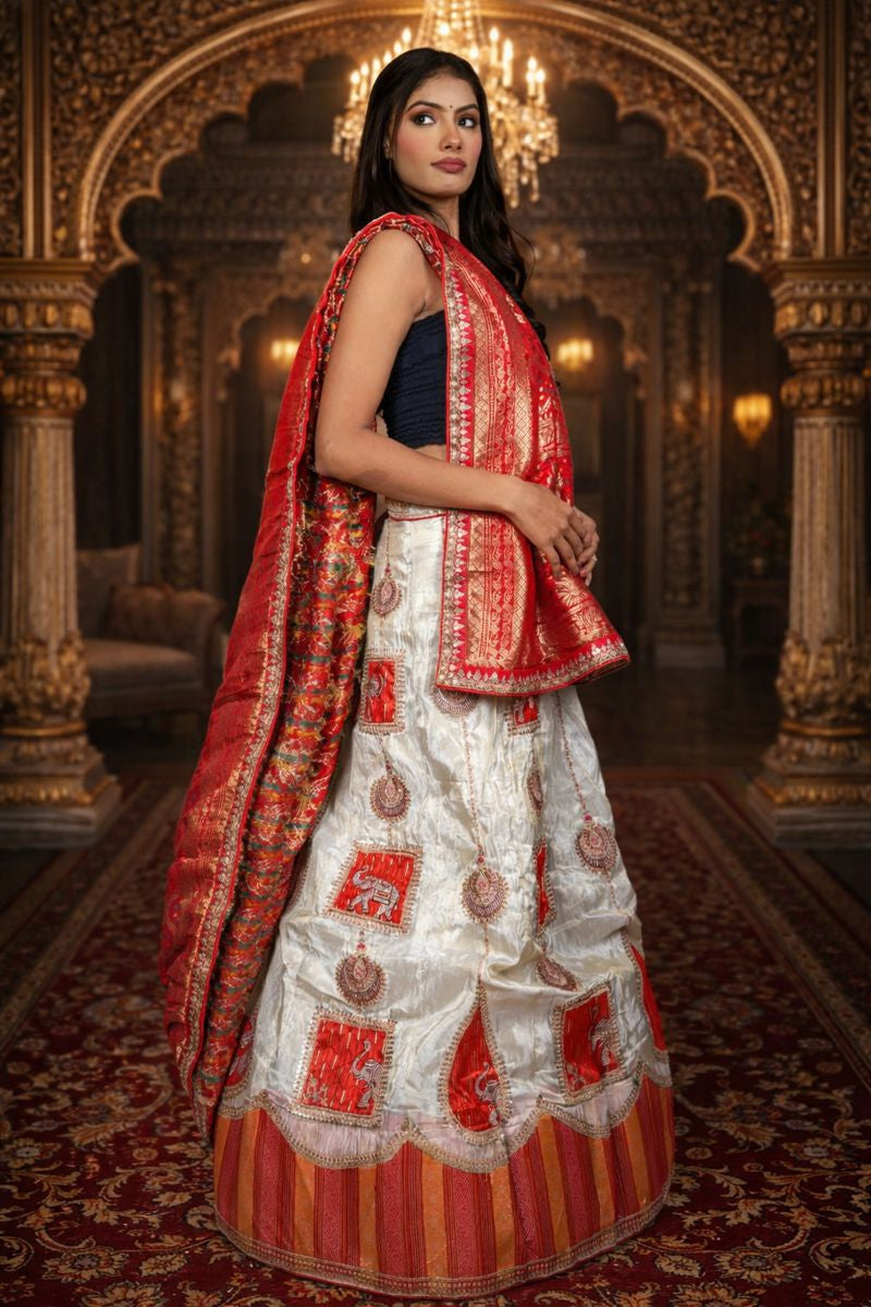 Cream & Red Shimmer Lehenga with Ganesha Embroidery and Banarasi Zari Dupatta